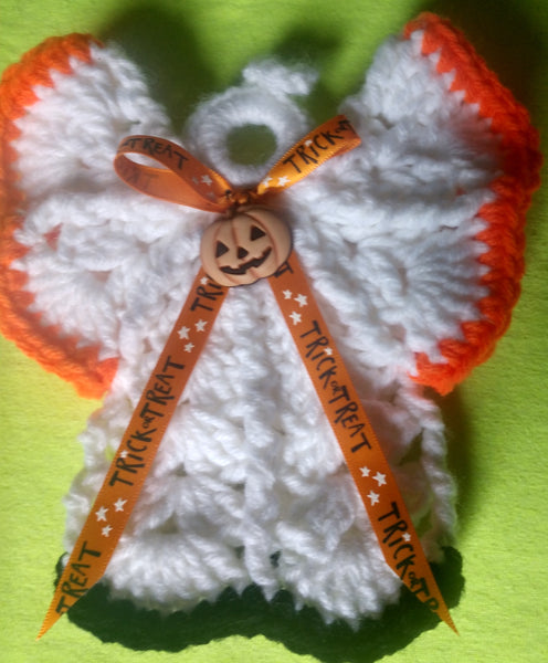 Halloween angel with trick or treat ribbon snd jack-o-lantern.